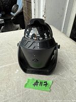 Front view showing compass dial, bracket and base