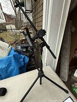 Full view of tripod fully extended with iKlip holder attached