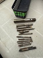 Top view of assorted hand taps and plastic basket