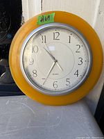 Front view of clock showing face, frame and size reference