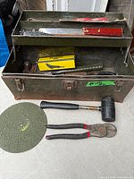 Overall view of toolbox, tray and several tools placed outside