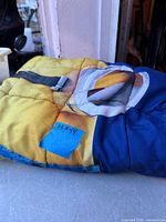 Folded weighted blanket showing quilted sections, multicolor print and measurement label 35 x 44