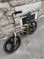 Left side view of full bicycle showing frame, wheels, seat