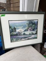 Front view of framed landscape print showing full frame and mat