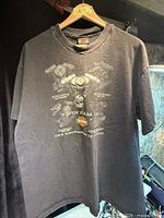 Full front view of faded black Harley-Davidson Twin Cam 88 graphic T-shirt on hanger