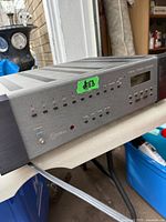 Front and left side view showing full chassis, buttons and LED indicators