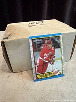 Closed box with sample Steve Yzerman 1989 O-Pee-Chee card standing in front