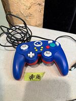 Front view of blue PDP Sonic wired controller with USB cable