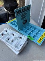 Fold-open plastic game board showing grid and instruction panel