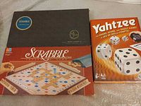 Overview showing both Scrabble boxed games and Yahtzee boxed game
