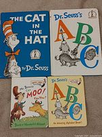 Four Dr. Seuss children’s books laid flat showing front covers