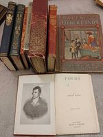 All eight books standing plus open Burns’s Poems frontispiece