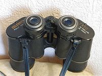 Front view of Celebrity 7x50 binoculars showing eyepieces, focus wheel, magnification and field markings