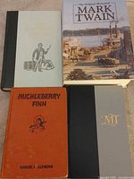 Front covers of all four Mark Twain books laid out
