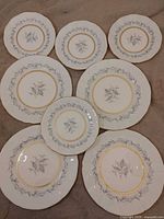 Eight Northumbria Morning Mist plates laid out: four dinner, four salad