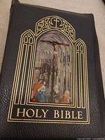 Front cover of Cathedral Edition leather Bible showing gilt Gothic arch and crucifixion image