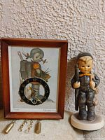 Clock and figurine side by side