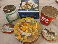 Group view showing all tins and sifter