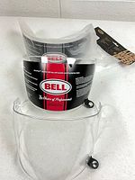 All three visors, two in Bell packaging and one loose clear visor