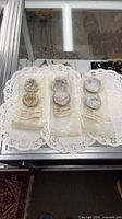 Three packaged geode pairs on display lace mat