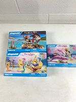 Group shot of three sealed Playmobil boxes