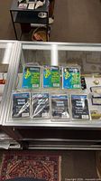 Display case with seven sealed UltraPro sleeve packs