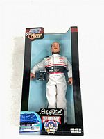 Front of sealed box showing figure through window