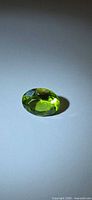 Oval-cut vivid green peridot front view