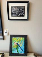 Group view of both framed artworks on wall
