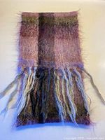 Full view of mohair scarf showing colour blocks and fringe