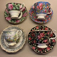 Four Royal Albert cup and saucer pairs displayed together