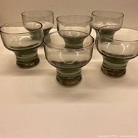 six smoky grey glass shot glasses front view