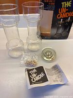 Entire set with holders, float, wicks, leaflet and box