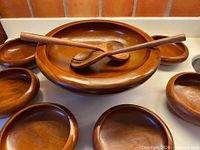 Full set showing large bowl, six small bowls, two servers
