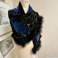 Wrap displayed on mannequin showing overall drape and feather edge