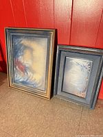 Both framed artworks side by side