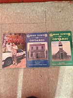 All three books side by side on floor