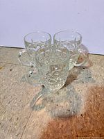 All three clear glass beer mugs grouped together