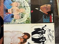 Front covers of all four vinyl records