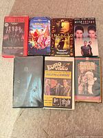 All seven VHS tapes laid out showing front covers