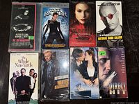 All eight VHS tapes laid out showing front covers