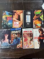 All eight VHS tapes laid out showing cover art