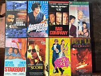 All eight VHS tapes arranged in two rows showing front sleeves