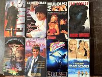 All eight VHS tapes laid out showing front covers