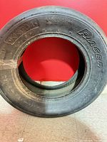 Full view of American Racer G60-15 tire upright