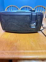 Front view of Bionaire AirButler air purifier showing grille and power cord