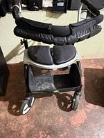 Front view showing basket, wheels, frame