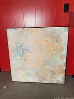 Front view of abstract painting showing colors and texture