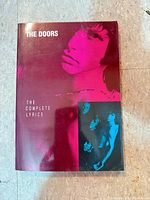 Front cover of the paperback lyric book