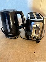 Toastmaster kettle and Black & Decker toaster side by side showing overall condition and cords